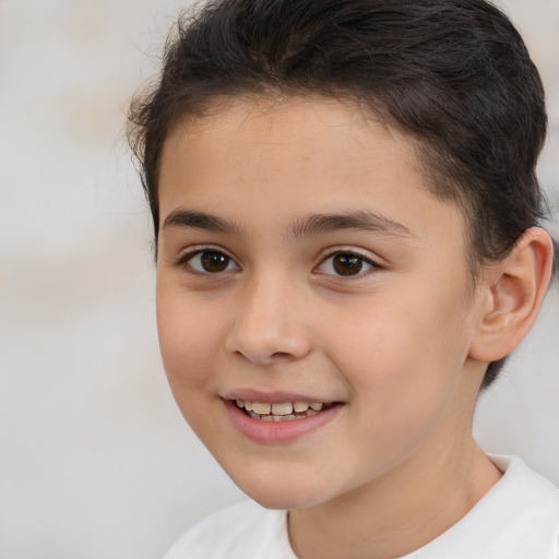 Joyful white child female with short  brown hair and brown eyes