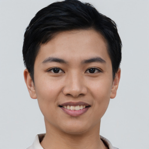 Joyful asian young-adult female with short  black hair and brown eyes