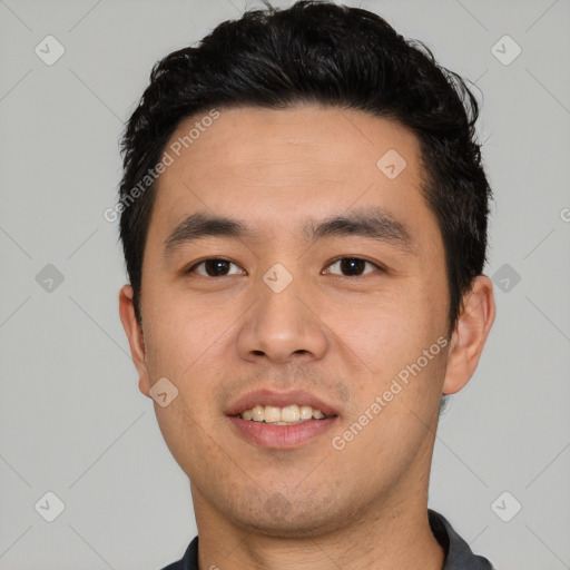 Joyful asian young-adult male with short  black hair and brown eyes