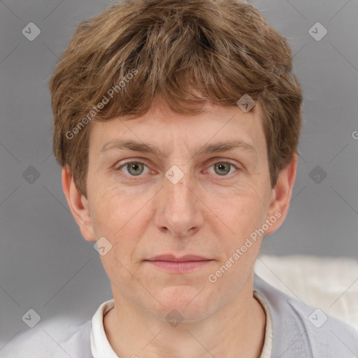 Joyful white adult male with short  brown hair and grey eyes