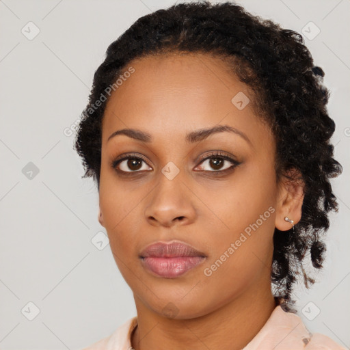 Neutral black young-adult female with medium  brown hair and brown eyes