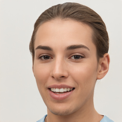 Joyful white young-adult female with short  brown hair and brown eyes