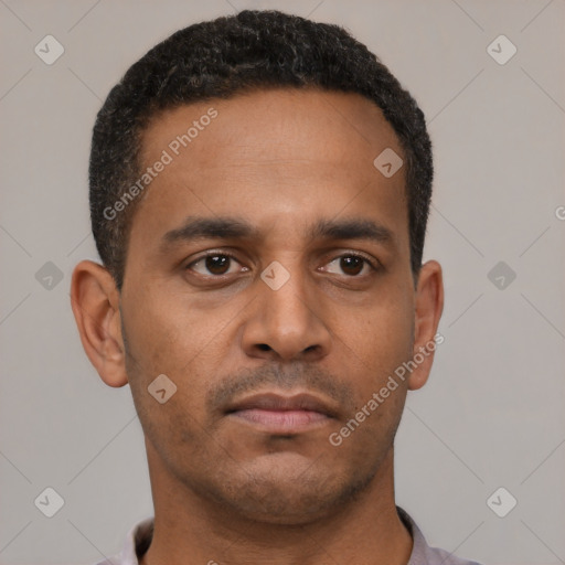 Neutral latino young-adult male with short  brown hair and brown eyes
