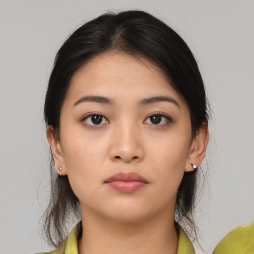Neutral asian young-adult female with medium  brown hair and brown eyes