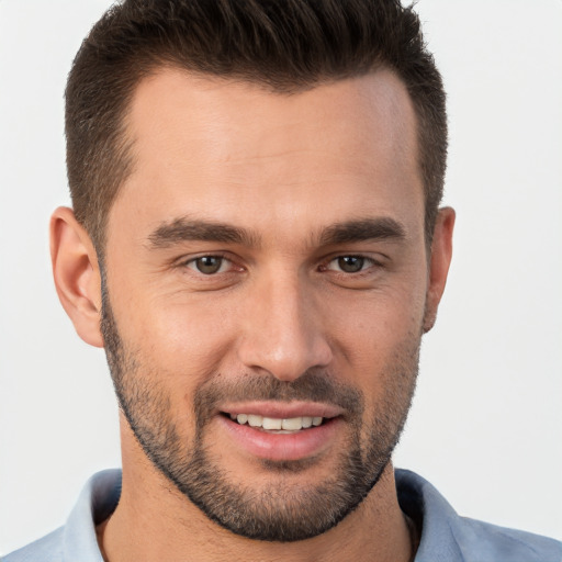 Joyful white young-adult male with short  brown hair and brown eyes