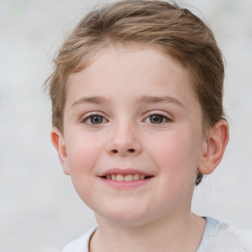 Joyful white child female with short  brown hair and blue eyes