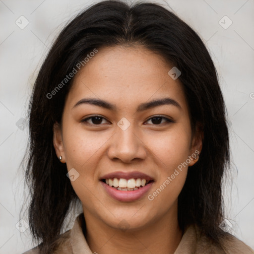 Joyful latino young-adult female with long  brown hair and brown eyes