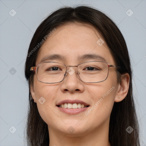 Joyful white adult female with long  brown hair and brown eyes