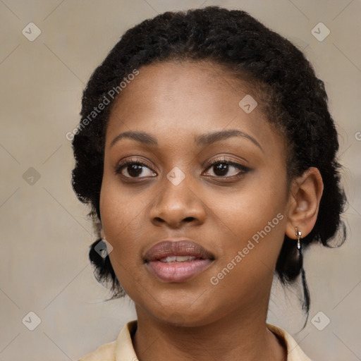 Joyful black young-adult female with medium  black hair and brown eyes