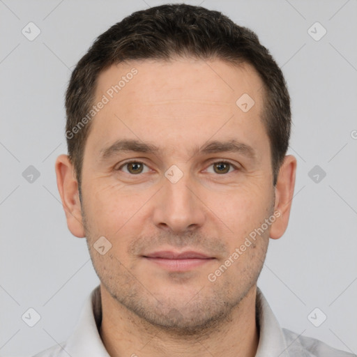 Joyful white adult male with short  brown hair and brown eyes