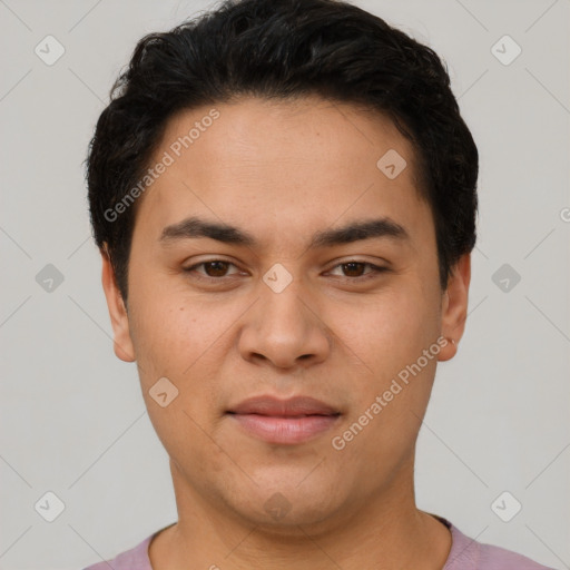 Joyful latino young-adult male with short  black hair and brown eyes