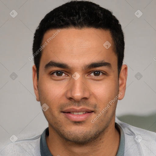 Joyful white young-adult male with short  black hair and brown eyes