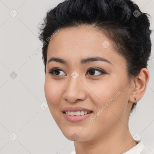 Joyful asian young-adult female with short  brown hair and brown eyes