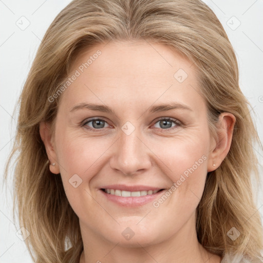 Joyful white young-adult female with medium  brown hair and blue eyes