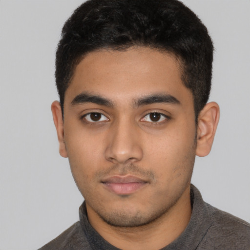 Neutral latino young-adult male with short  brown hair and brown eyes