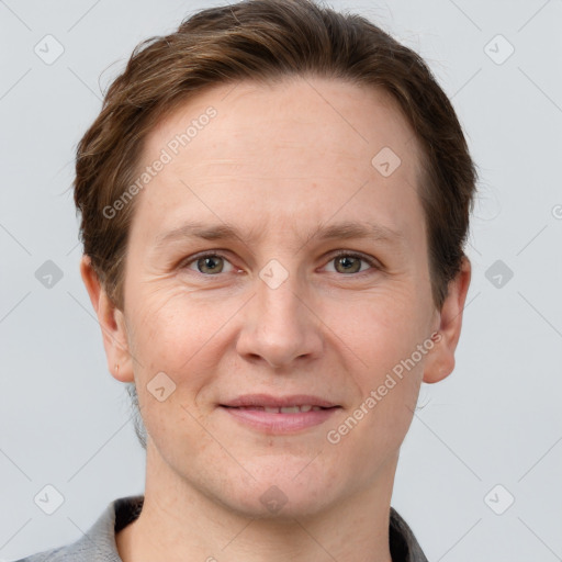 Joyful white adult female with short  brown hair and grey eyes