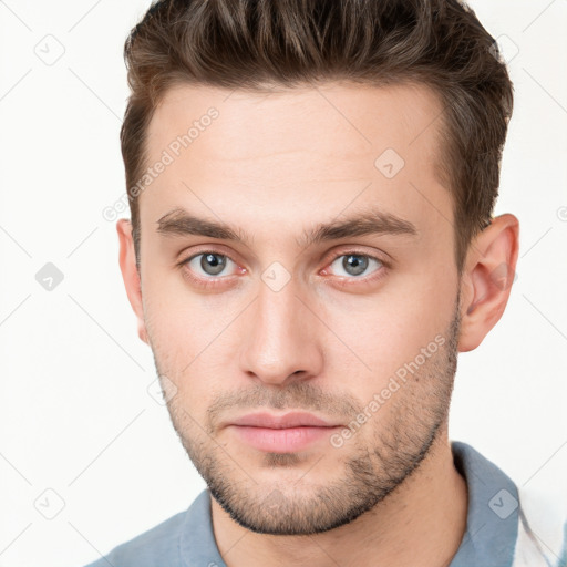 Neutral white young-adult male with short  brown hair and grey eyes