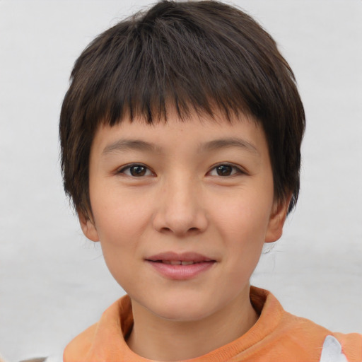 Joyful asian child female with short  brown hair and brown eyes