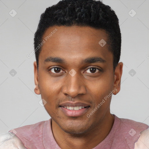 Joyful black young-adult male with short  black hair and brown eyes