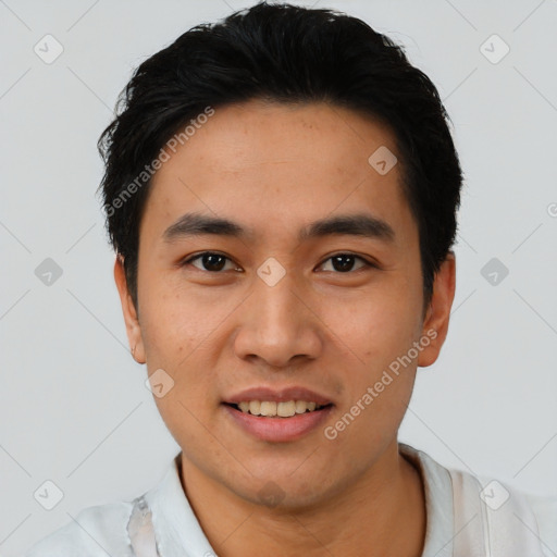 Joyful asian young-adult male with short  black hair and brown eyes