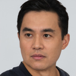 Neutral asian young-adult male with short  black hair and brown eyes