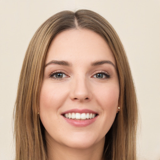 Joyful white young-adult female with long  brown hair and green eyes