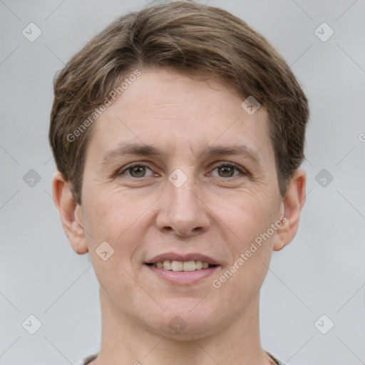 Joyful white adult male with short  brown hair and grey eyes