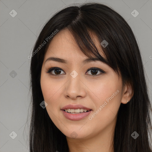 Joyful asian young-adult female with long  brown hair and brown eyes