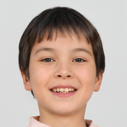 Joyful white child male with short  brown hair and brown eyes