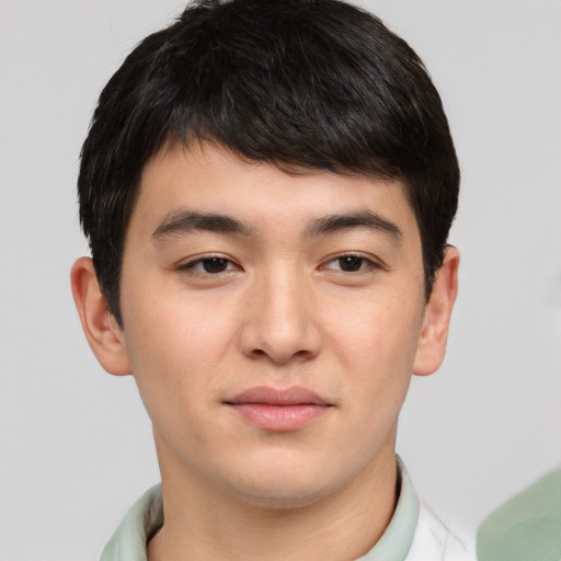 Joyful asian young-adult male with short  brown hair and brown eyes