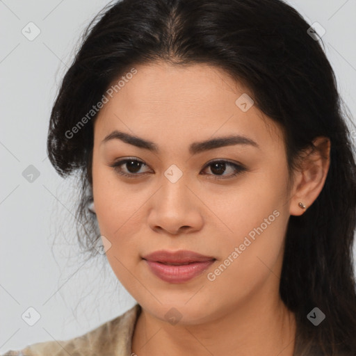 Joyful latino young-adult female with long  brown hair and brown eyes