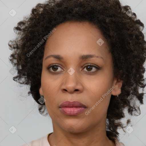 Joyful black young-adult female with medium  brown hair and brown eyes