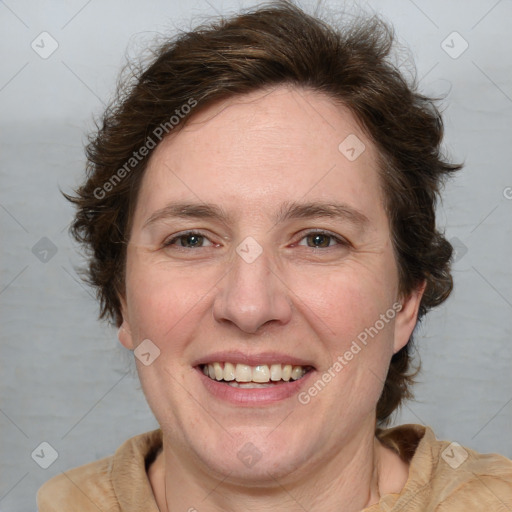 Joyful white adult female with medium  brown hair and blue eyes