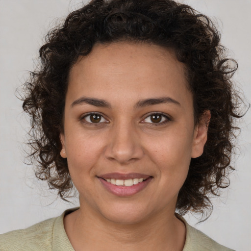Joyful white young-adult female with medium  brown hair and brown eyes