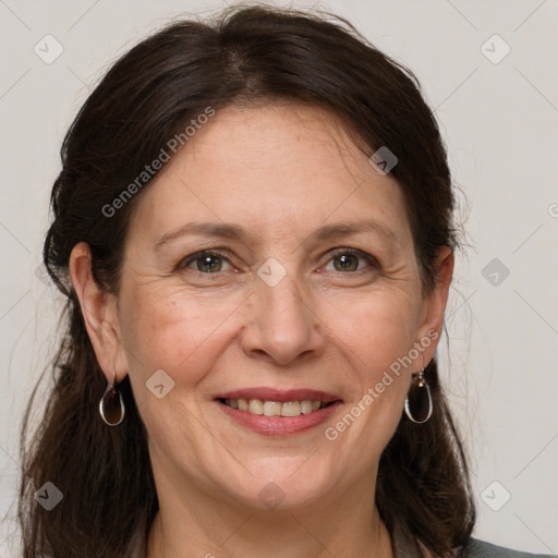 Joyful white adult female with medium  brown hair and grey eyes