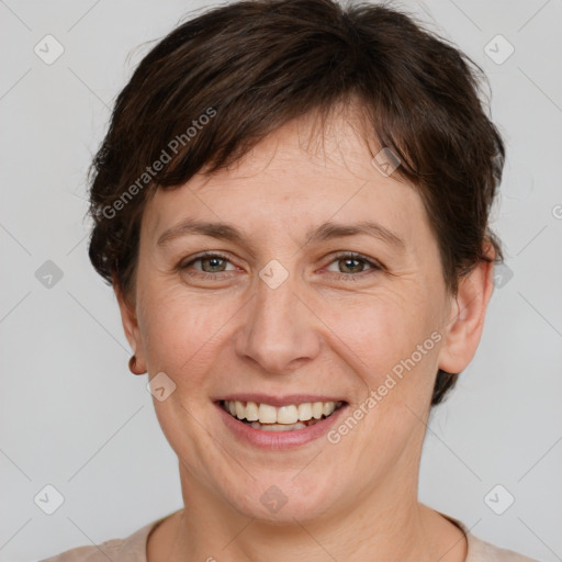 Joyful white adult female with short  brown hair and grey eyes