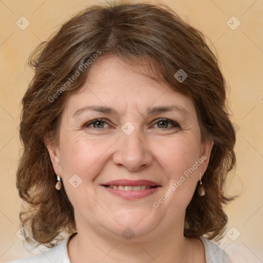 Joyful white adult female with medium  brown hair and brown eyes