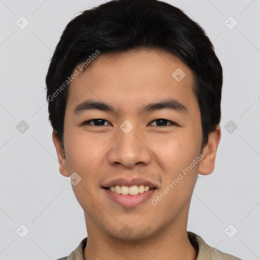 Joyful asian young-adult male with short  black hair and brown eyes