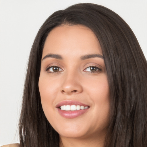 Joyful white young-adult female with long  black hair and brown eyes