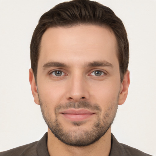 Joyful white young-adult male with short  brown hair and brown eyes