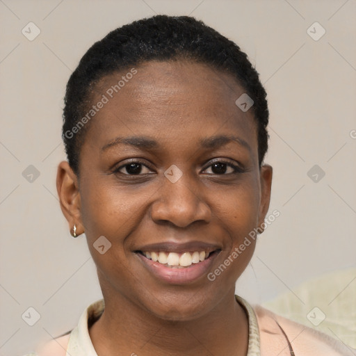 Joyful black young-adult female with short  black hair and brown eyes