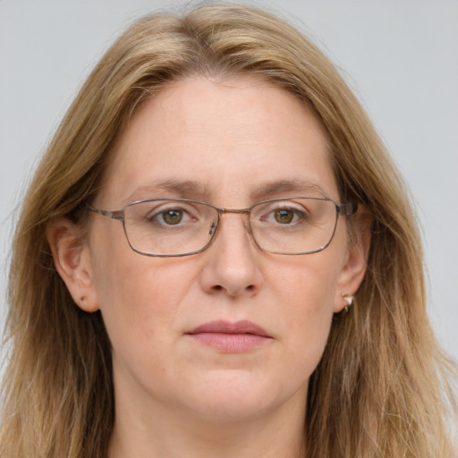 Joyful white adult female with long  brown hair and brown eyes