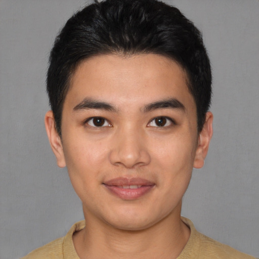 Joyful asian young-adult male with short  brown hair and brown eyes