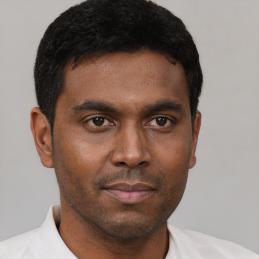 Neutral black young-adult male with short  black hair and brown eyes
