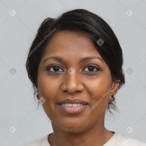 Joyful black adult female with medium  brown hair and brown eyes