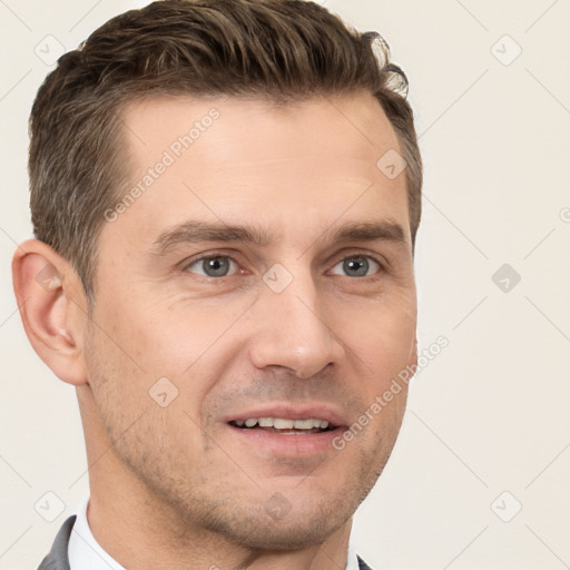 Joyful white young-adult male with short  brown hair and grey eyes