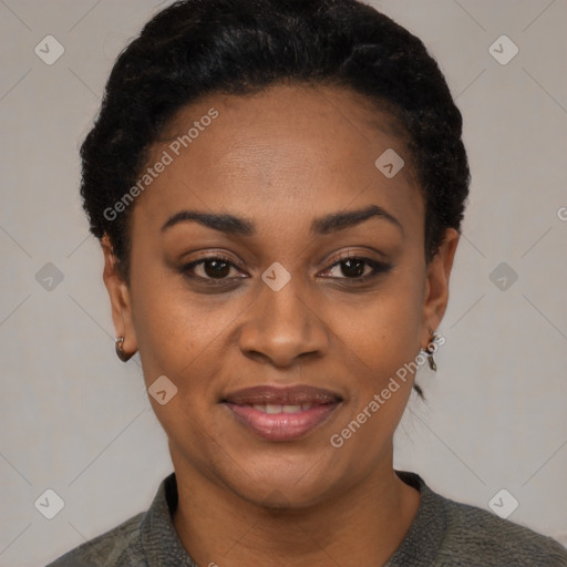 Joyful black young-adult female with short  black hair and brown eyes