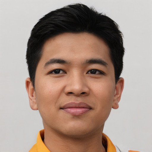 Joyful asian young-adult male with short  black hair and brown eyes
