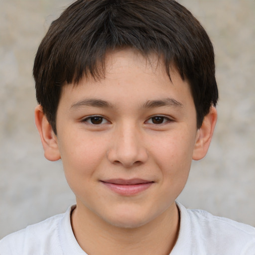 Joyful white child male with short  brown hair and brown eyes