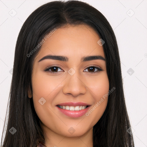 Joyful latino young-adult female with long  black hair and brown eyes